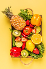 Naklejka na ściany i meble Fruits and vegetables rich in vitamin C in box.