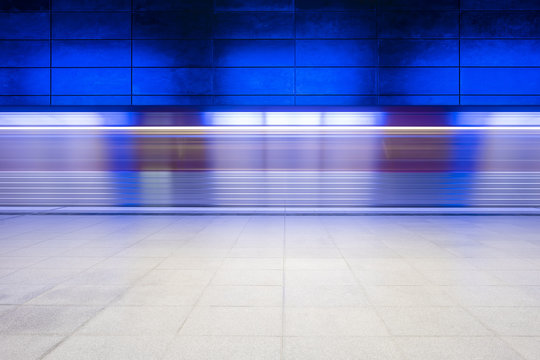 Fast moving train in station