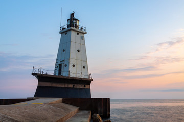 Fototapeta na wymiar Lake Michigan Lighthouse At Sunset