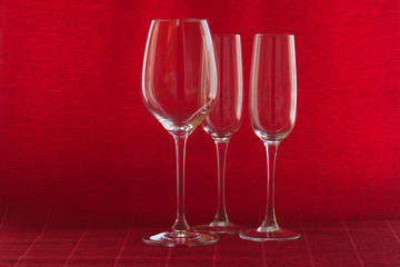 Wine glasses on a red background