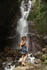 Obraz premium Woman near waterfal on Bali, Indonesia&nbsp;