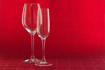 Wine glasses on a red background