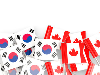 Pins with flags of South Korea and canada isolated on white.