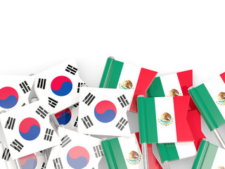 Pins with flags of South Korea and mexico isolated on white.