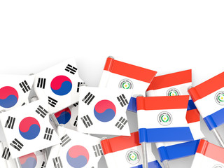 Pins with flags of South Korea and paraguay isolated on white.