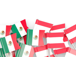 Pins with flags of Mexico and austria isolated on white.
