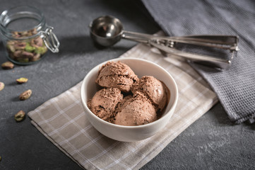 Bowl of chocolate ice cream on rustic background