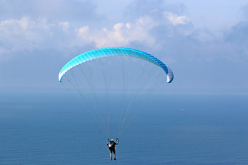 Paraglider above the sea