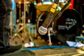 Close up of microphone on stage in audience room blur background.