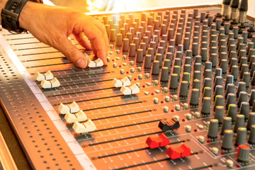 Naklejka premium Close-up control panel button of sound recording control desk, music mixer in studio for music producer. Music & Event party Müzik mikser Music Mixer Desk Control display Equalizer mixer switch