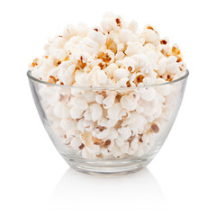 Popcorn in glass bowl isolated on white background