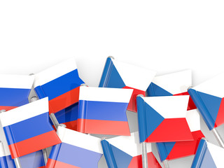 Pins with flags of Russia and czech republic isolated on white.