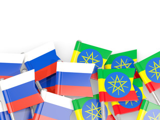 Pins with flags of Russia and ethiopia isolated on white.