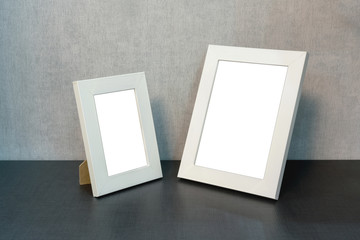 big and small empty white frame for a picture and a photo on the shelf, mock-up