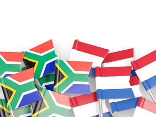 Pins with flags of South Africa and netherlands isolated on white.