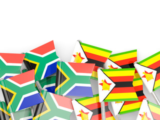 Pins with flags of South Africa and zimbabwe isolated on white.