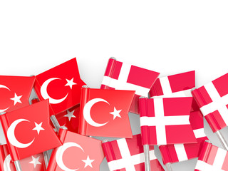 Pins with flags of Turkey and denmark isolated on white.