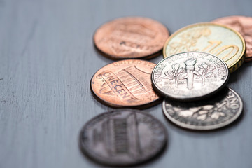 Closeup USA coins on wooden table. Saving and investment concept.