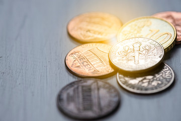 Closeup USA coins on wooden table. Saving and investment concept.