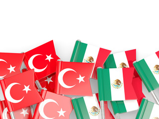 Pins with flags of Turkey and mexico isolated on white.