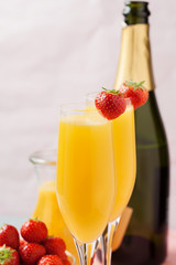 Mimosa cocktail and strawberries