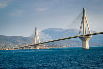 The Rio Antirrio Bridge, is one of the world's longest multi-span cable-stayed bridges and longest of the fully suspended type. It crosses the Gulf of Corinth over the deep blue sea near Patras.