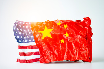 Wrinkle of USA and China flag on sky background. It is symbol of United states of America and China...