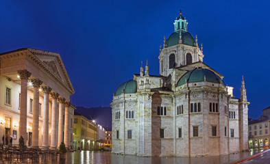 Como - The portal of Duomo and Teatro Sociale at dusk.