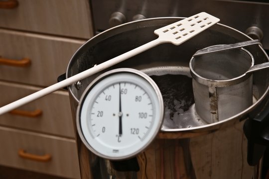 Brewing craft beer in a kitchen. Home brewing concept image. 