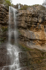 Landscape view of waterfall coming out of rock wall. Skaklya waterfall  is the highest waterfall on Balkan peninsula,  Balkan mountain range ( Stara Planina),  Bulgaria.