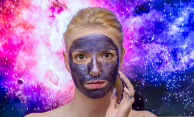 Blonde model wearing a galaxy, sparkle peel off  mask