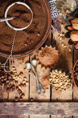 Roasted black and green coffee beans and ground coffee in the plate