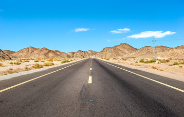 Road through mountains in desert