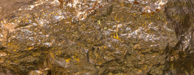 texture of natural geological mineral golden pyrite