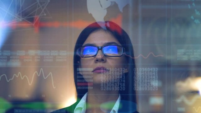 The woman in glasses on the hologram background
