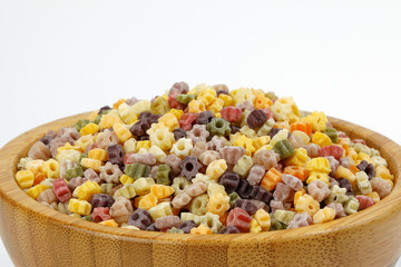 Colourful star shaped pasta macaroni vegetable on white background
