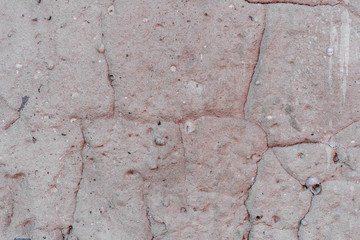 Texture, wall, concrete, it can be used as a background. Wall fragment with scratches and cracks