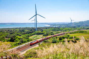 rainway at the coastline with wind turbine in Miaoli, Taiwan