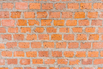 The texture of the red brick wall is very smooth.