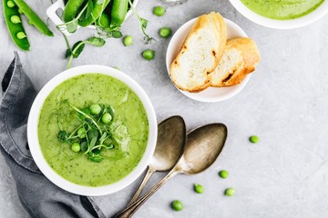 Summer cream soup with green fresh pea shoots