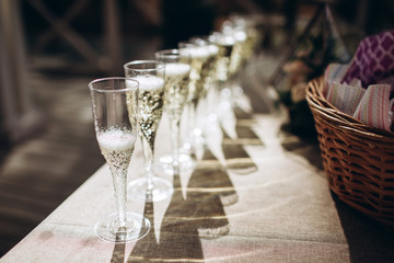 The waiter pours champagne to a party. glasses of champagne.