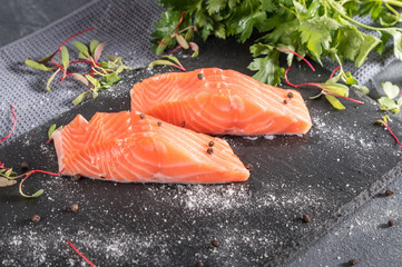 fresh raw salmon fillet with aromatic herbs spices