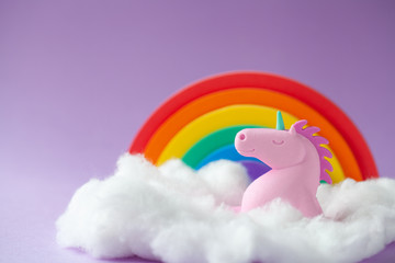 Happy Unicorn Sitting on a cloud