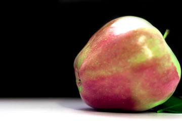 Fresh green apple on a black reflective background, Studio shot,