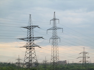 Electric supports against the backdrop of a stormy sky