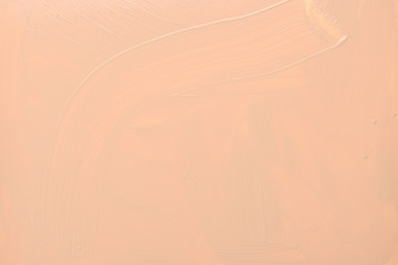 Liquid foundation texture. Make up for women. Top view.