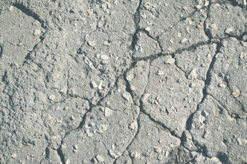Macro closeup on concrete asphalt cracks on the road