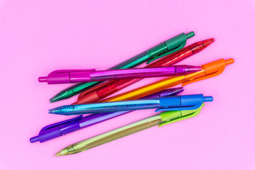 Multi color pen on pink pastel color