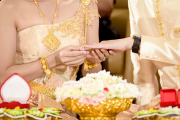 Thai people wearing wedding ring at wedding day 