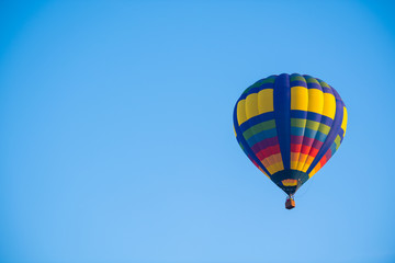 Colorful of balloon on blue sky with copy space
